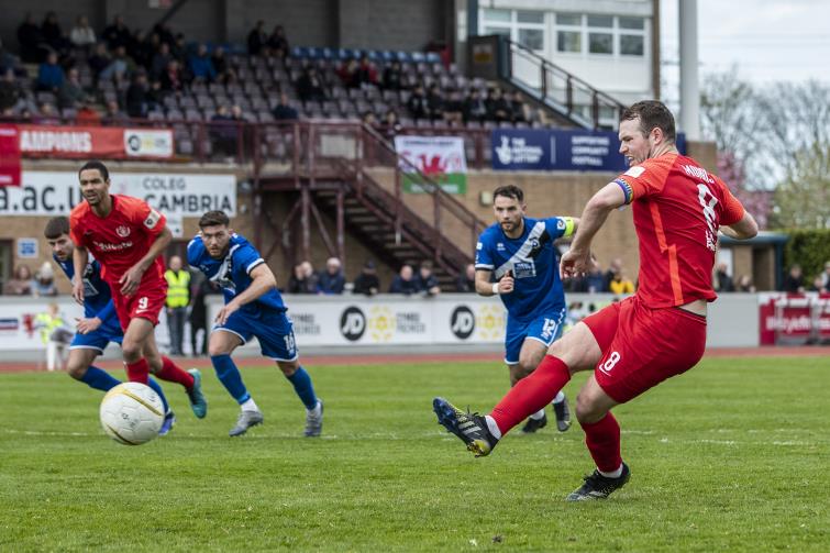 Callum Morris - scores from the spot to give Nomads the lead at Deeside